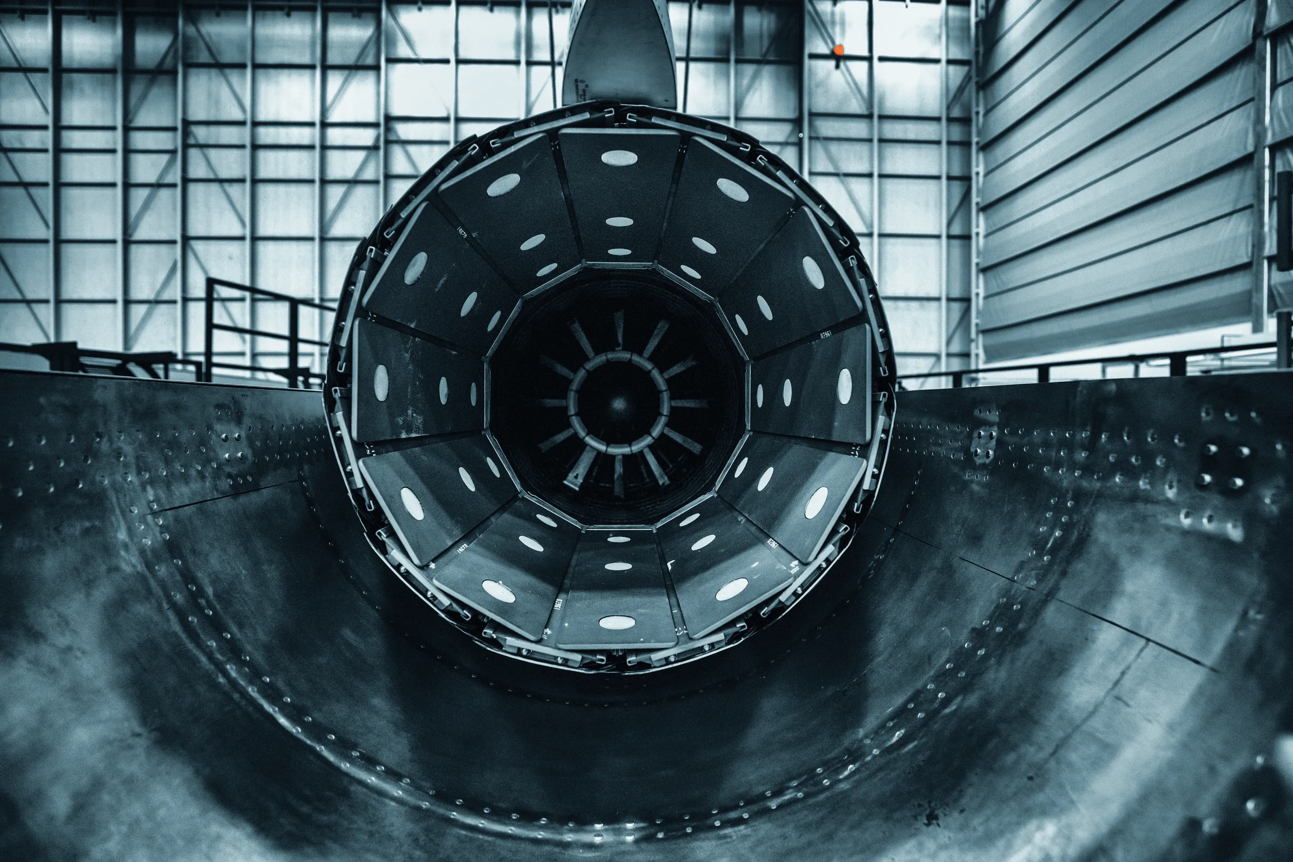 Looking into an aircraft engine nozzle in a test hangar