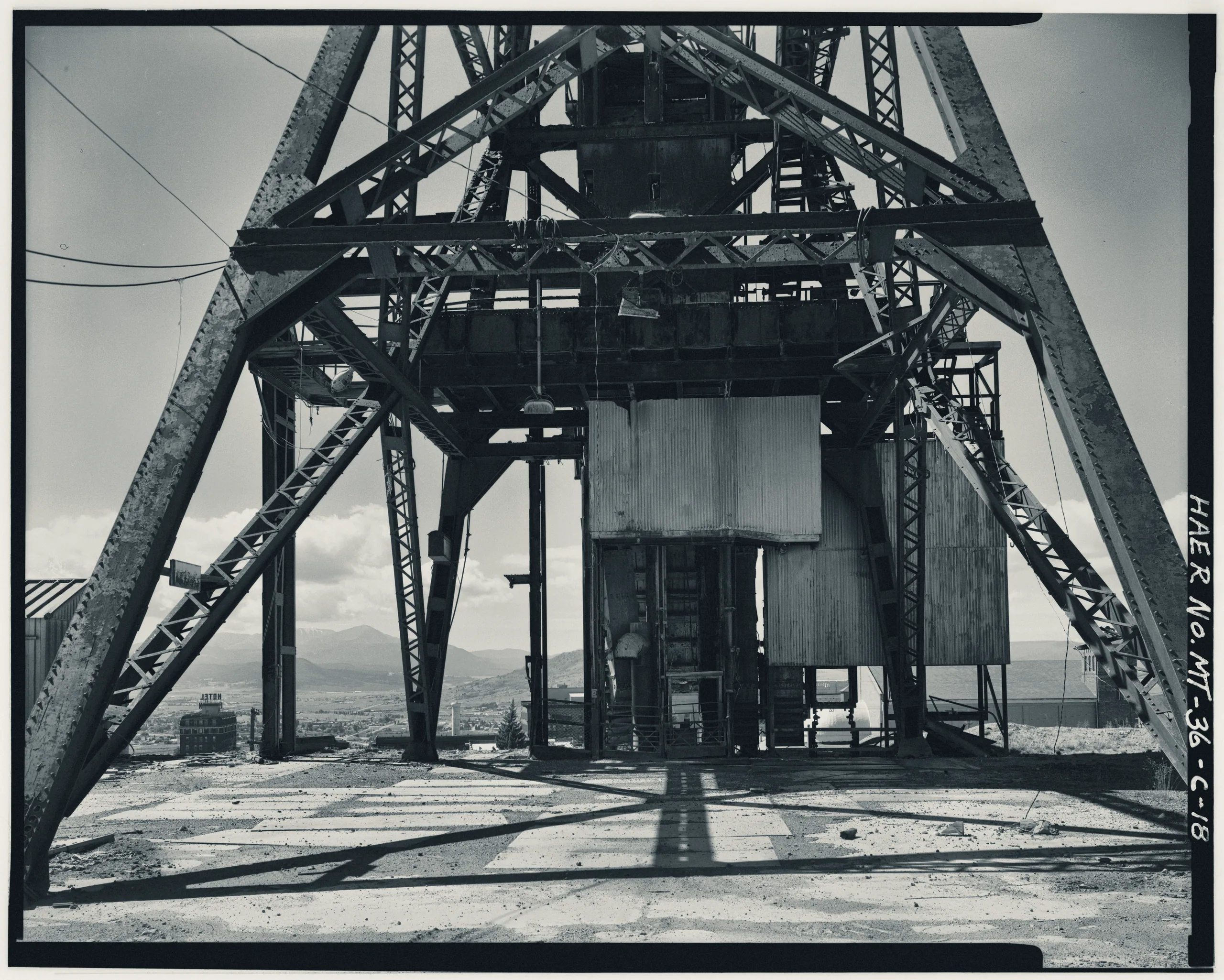 Detail of shaft collar and cage guides. view looking south includes detail of riveted steel construction of headframe