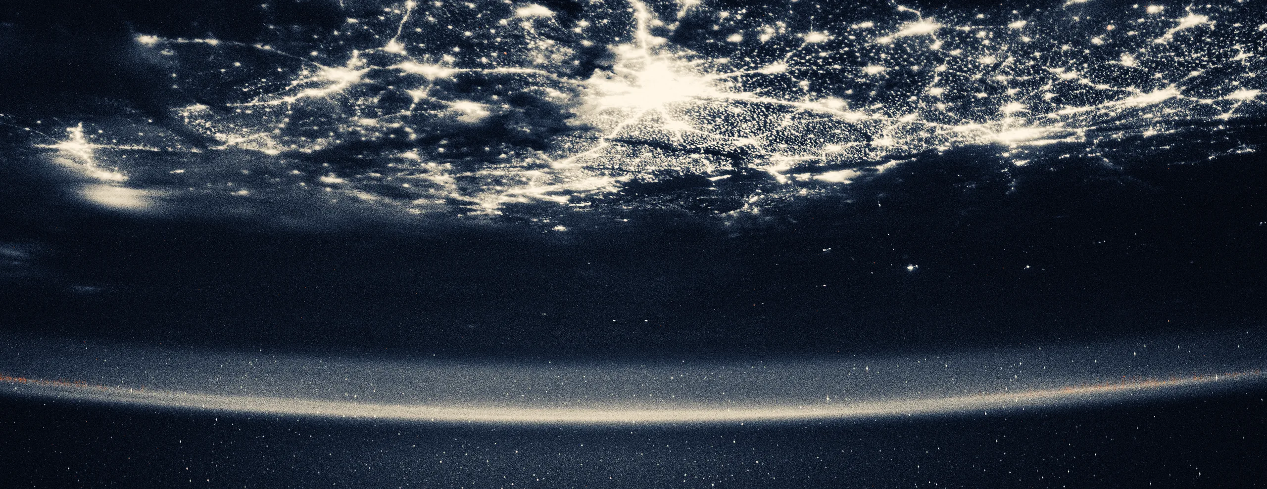 The city lights of New Delhi, India, underneath a starry night sky