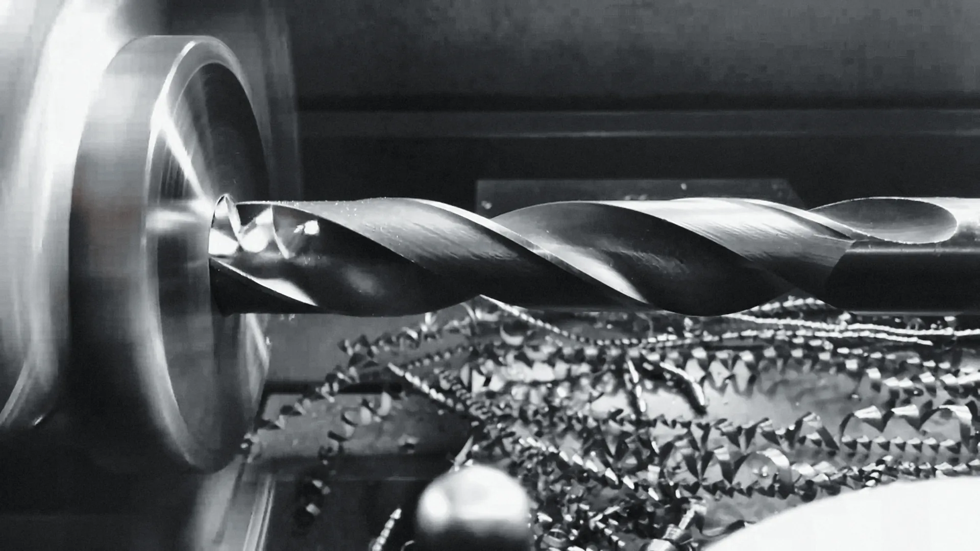 A drill boring a gear blank on a lathe