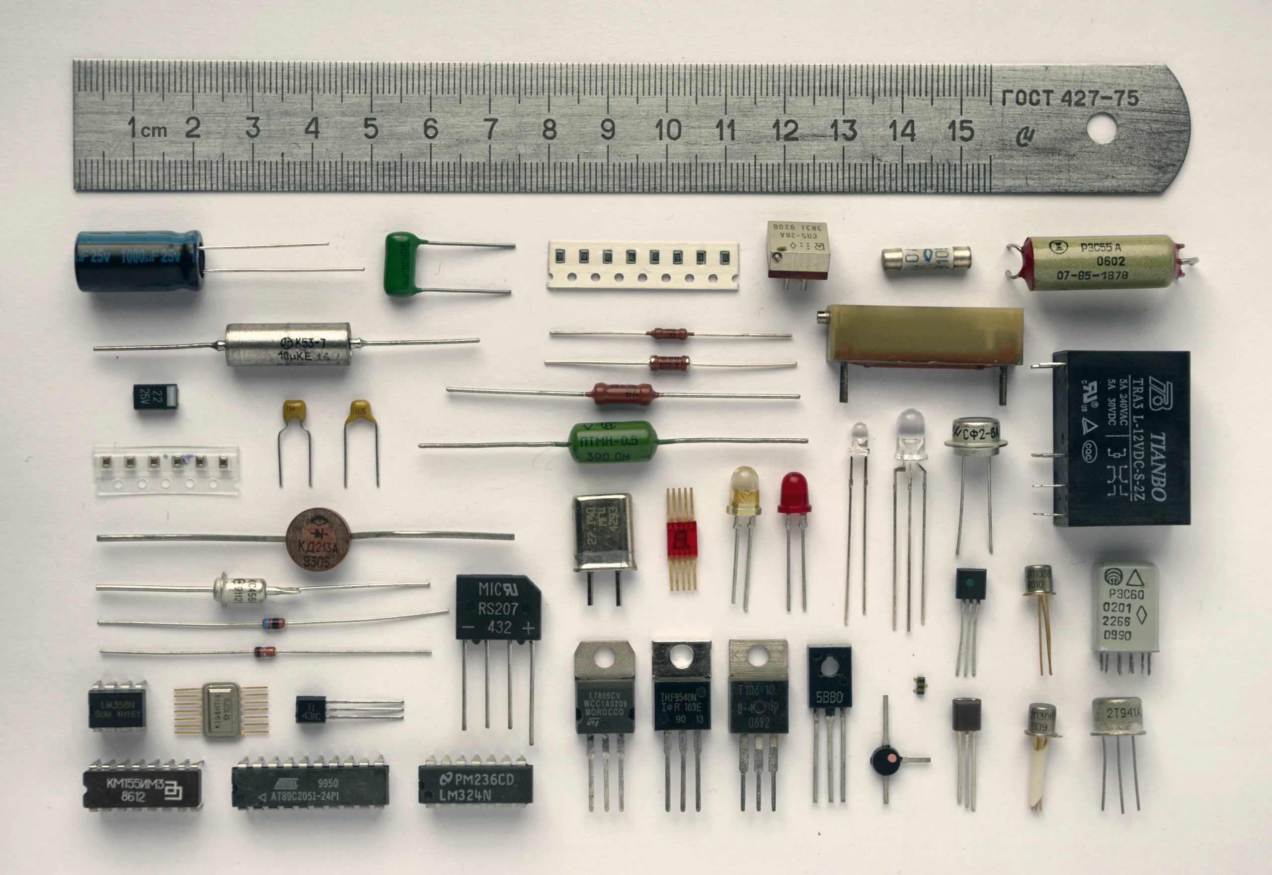 Electronic components laid out beside a ruler