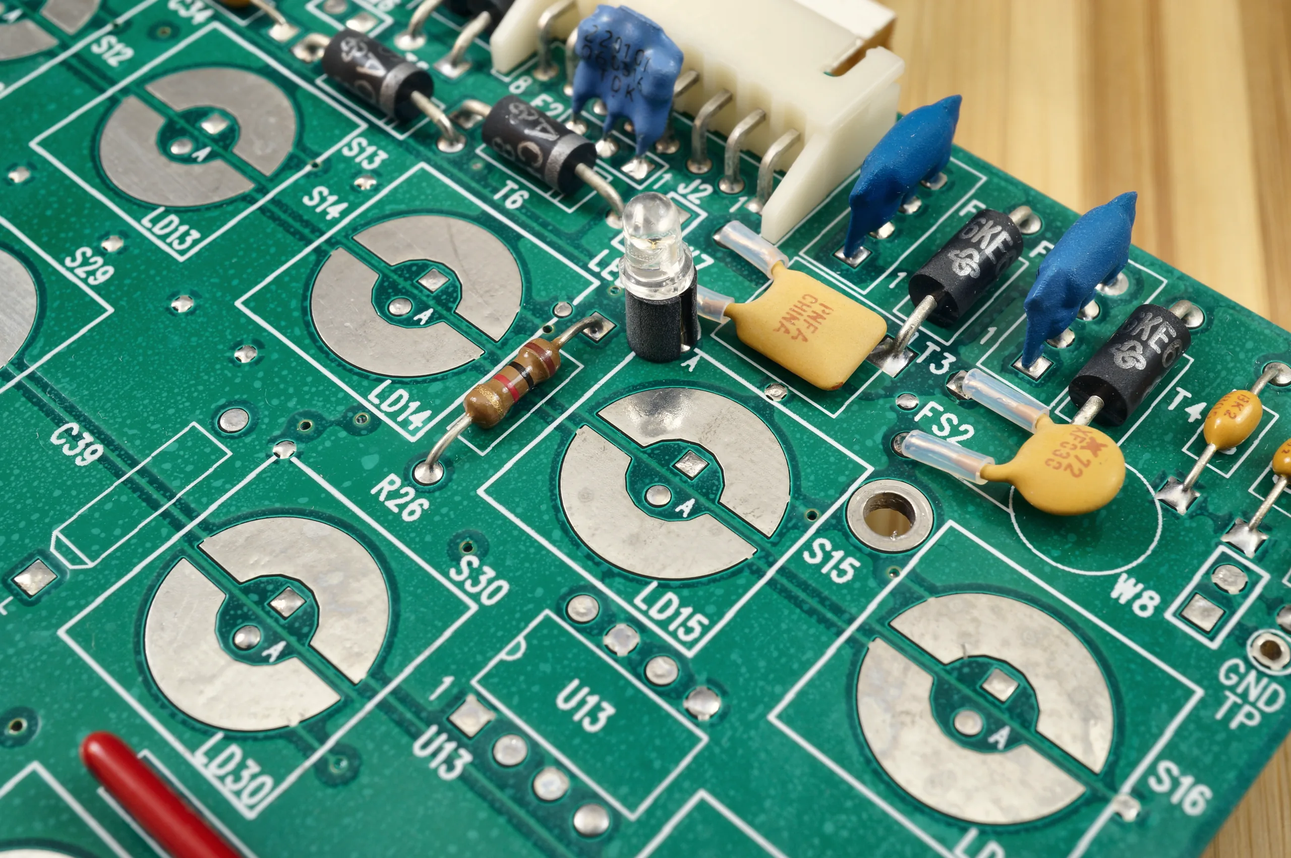 Through-hole components and an LED on a circuit board