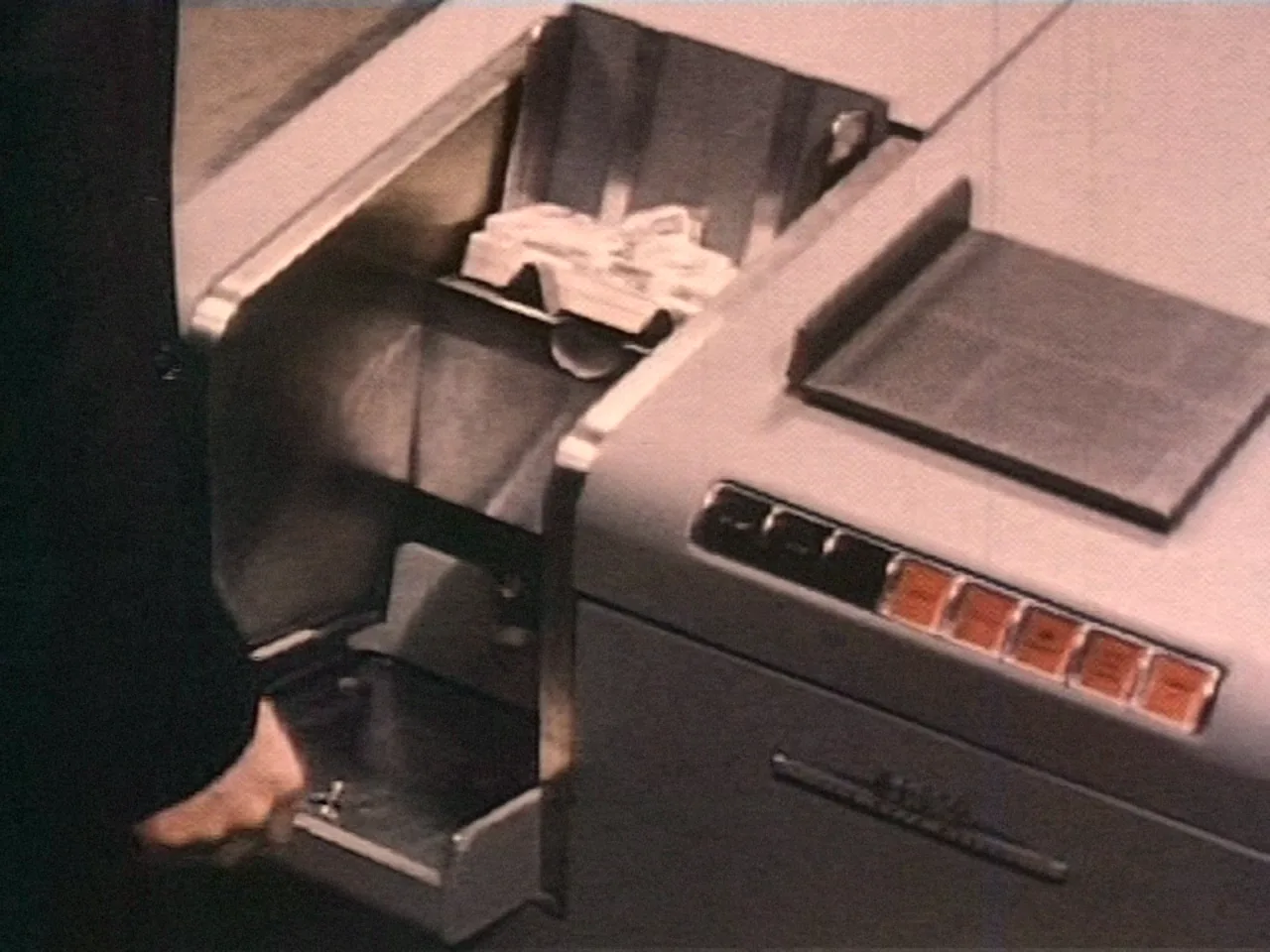 A deck of punched cards loaded into a reader — On Guard! (1956)
