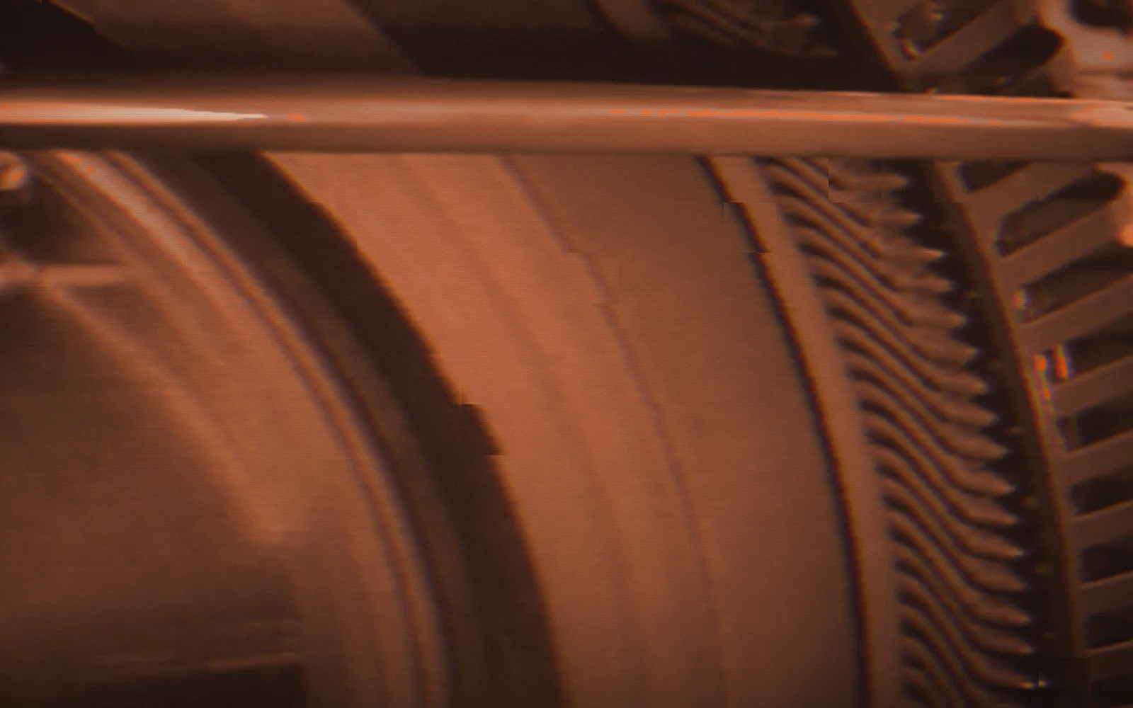 Gear being cut — Master Hands, 1936; the film broken up by digital glitches, pixel-sorted in the brand's orange