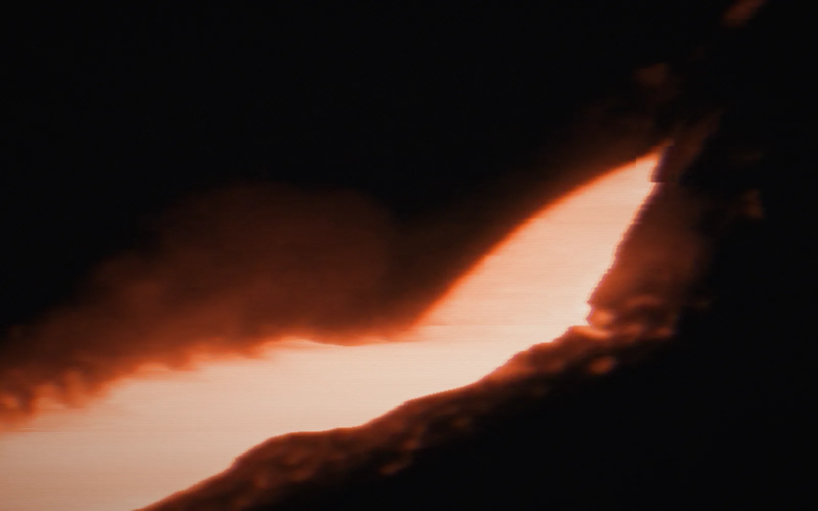 Copper being poured — Copper Mining and Smelting (undated); the film broken up by digital glitches, pixel-sorted in the brand's orange