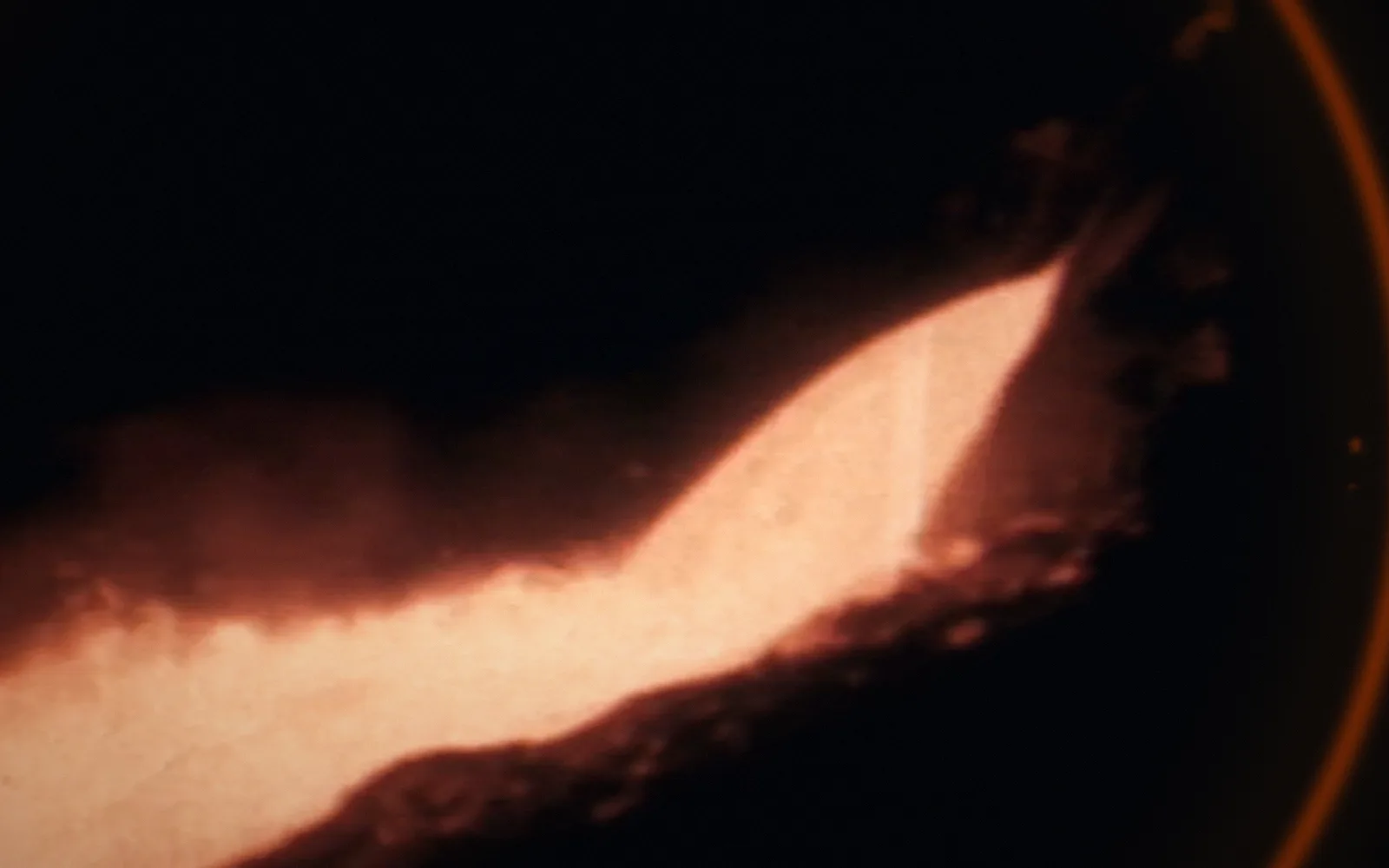 Copper being poured — Copper Mining and Smelting (undated); a disruption moves through the picture as a ring, pixel-sorted in the brand's orange