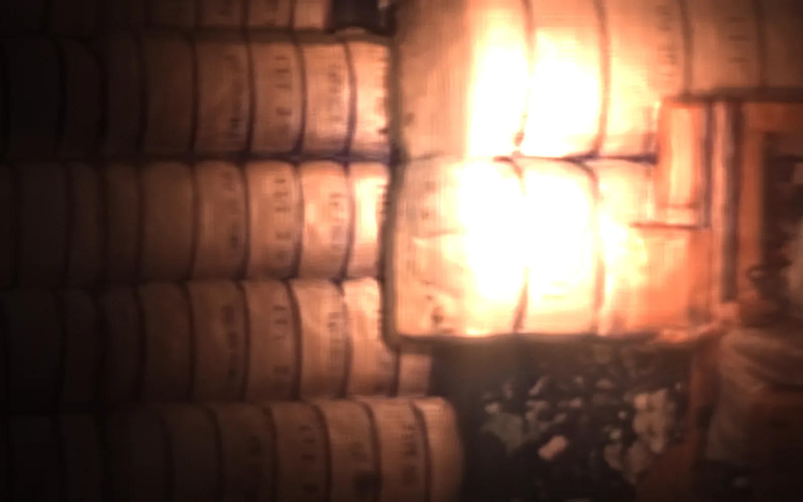 Cotton bales, stored — How Textile Mills Are Modernizing, 1948; the film lit again by a moving light, the rest in shadow