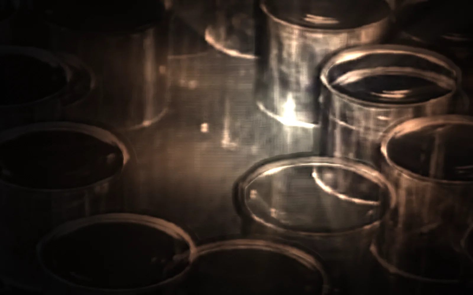 Can bodies — Miracle of the Can, 1956; the film lit again by a moving light, the rest in shadow