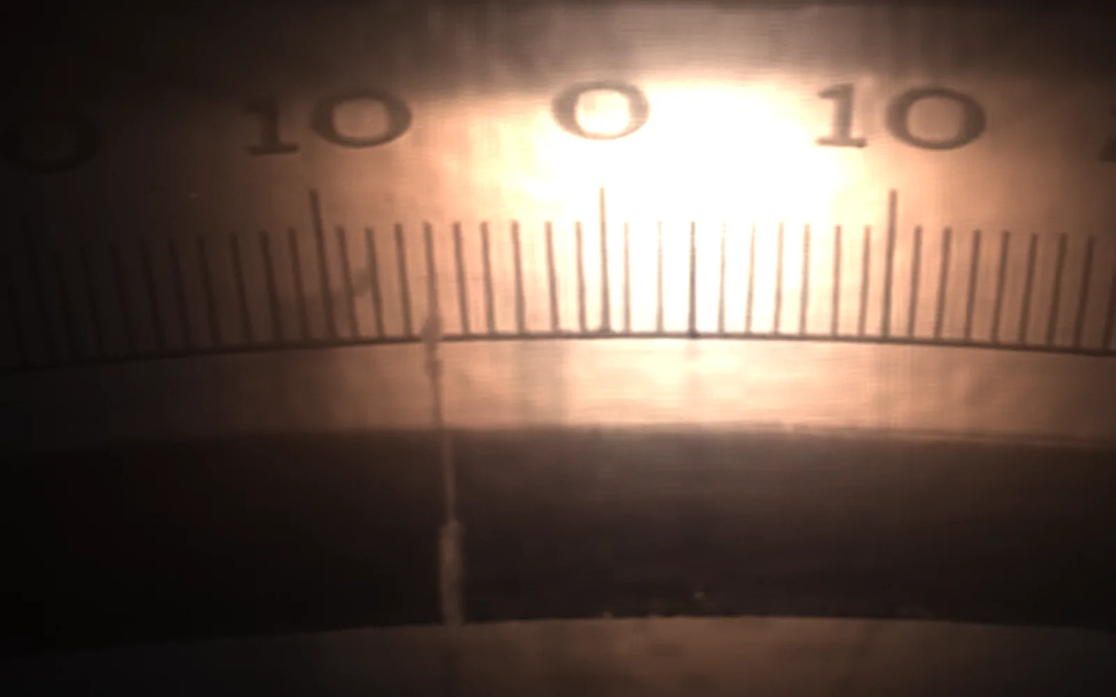A dial scale — Precisely So, 1937; the film lit again by a moving light, the rest in shadow